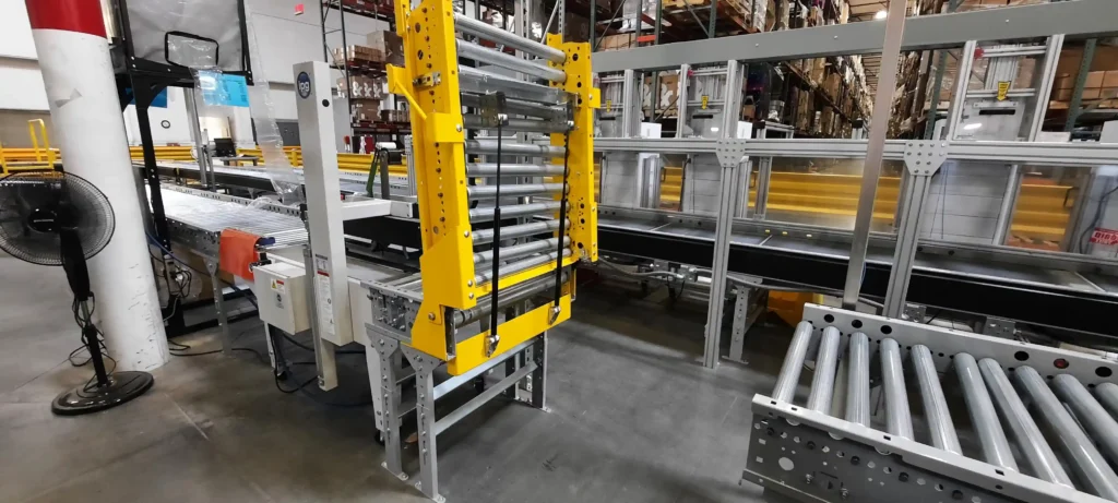 A conveyor system with an opened gate.