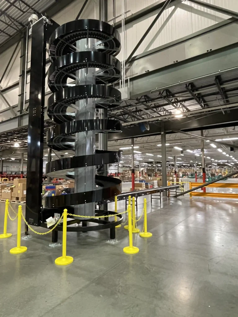 A Ryson 480V spiral conveyor designed to move product up while traveling in a spiral.